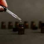 selective focus photography of brown tinted glass bottle